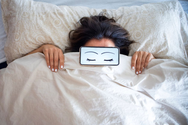 woman sleeping paper eyes